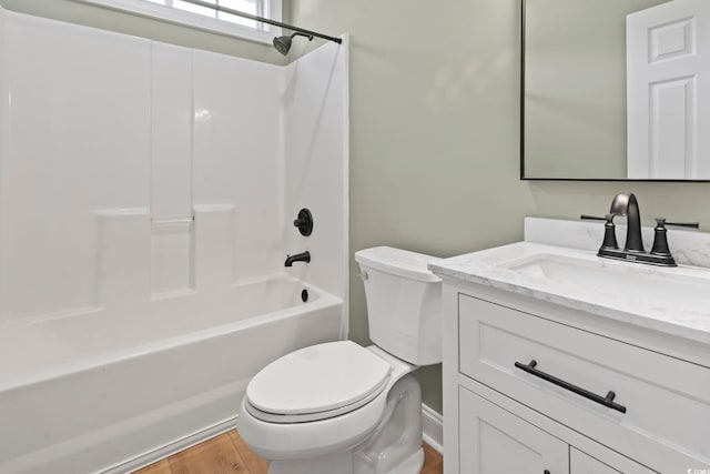 full bathroom with toilet, vanity, tub / shower combination, and hardwood / wood-style flooring