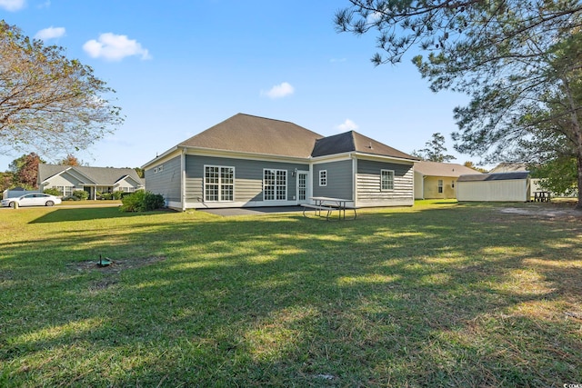 back of house featuring a yard