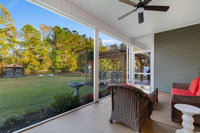 sunroom featuring ceiling fan