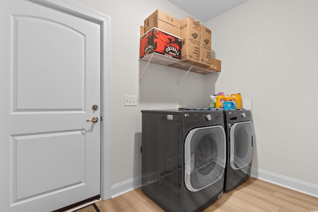 washroom featuring independent washer and dryer and light wood-type flooring