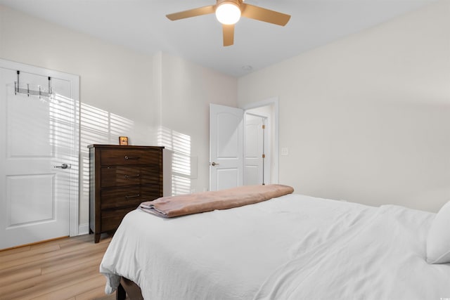 bedroom featuring ceiling fan and light hardwood / wood-style floors