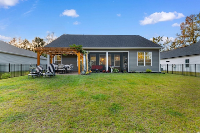 back of house with a lawn and a pergola