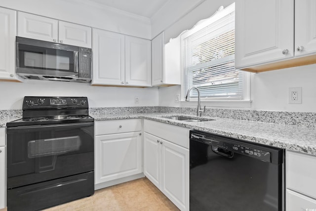 kitchen with black appliances, sink, ornamental molding, light tile patterned flooring, and white cabinetry