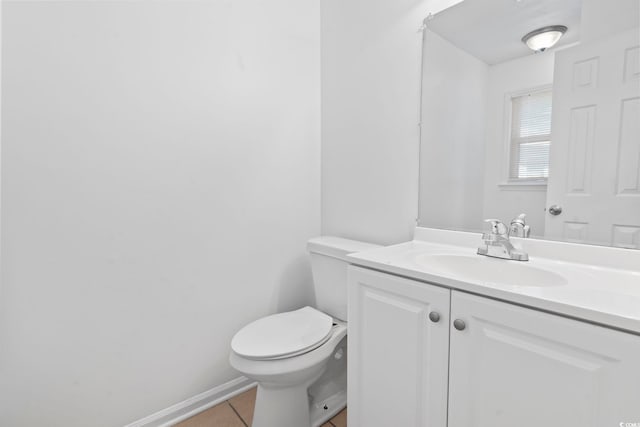 bathroom with tile patterned floors, vanity, and toilet