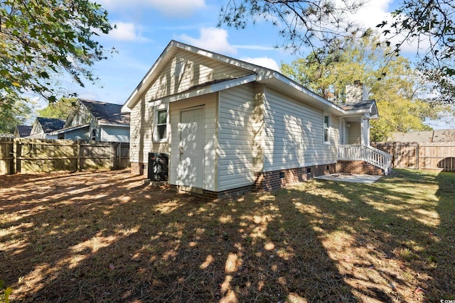 view of home's exterior with a yard