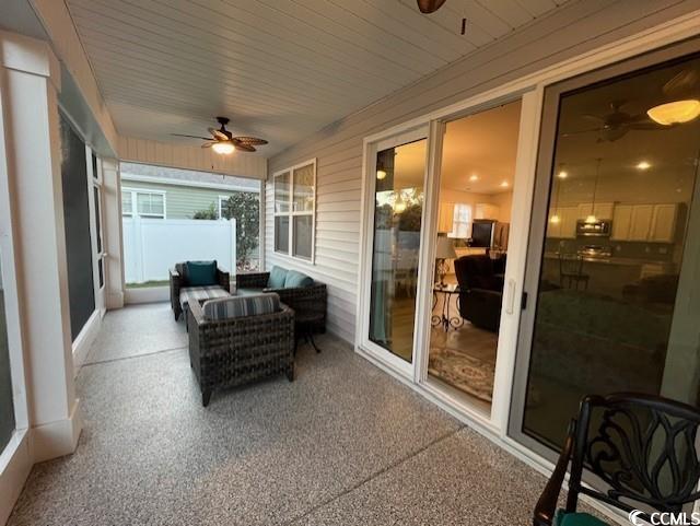 sunroom / solarium with ceiling fan