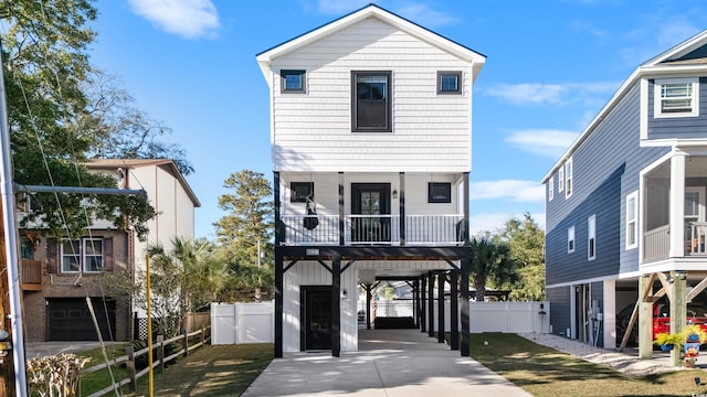 view of front of home featuring a carport and a balcony