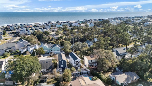 drone / aerial view with a water view and a residential view