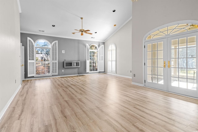 unfurnished living room featuring french doors, light hardwood / wood-style floors, plenty of natural light, and ornamental molding