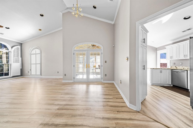 interior space featuring light hardwood / wood-style floors, plenty of natural light, and ornamental molding