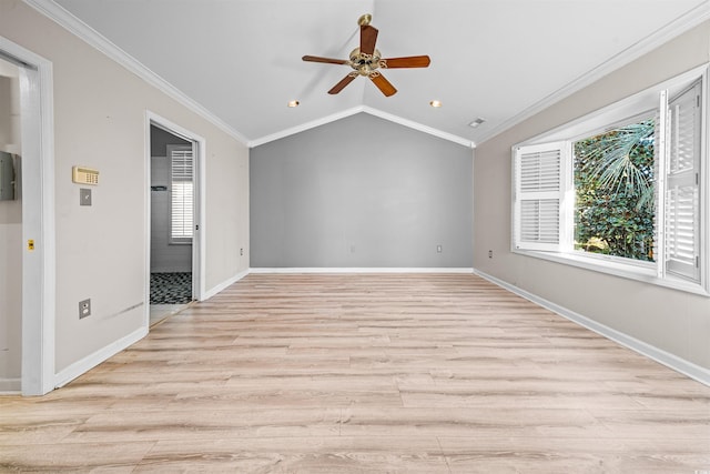 empty room featuring ceiling fan, light hardwood / wood-style floors, lofted ceiling, and ornamental molding