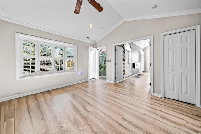 unfurnished room with ceiling fan, lofted ceiling, crown molding, and light hardwood / wood-style flooring