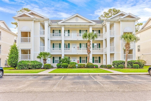 612 River Oaks Dr Unit 55D, Myrtle Beach, SC 29579 - view of building exterior featuring uncovered parking