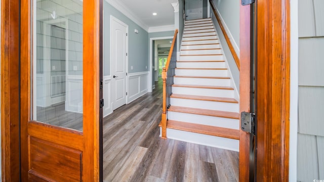 1010 Club House Dr, North Myrtle Beach, SC 29582 - stairway featuring ornamental molding, wood finished floors, and a wainscoted wall