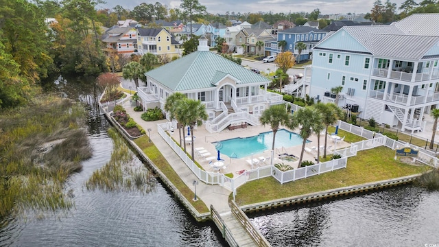 1010 Club House Dr, North Myrtle Beach, SC 29582 - aerial view of residential area featuring a large body of water and a pool