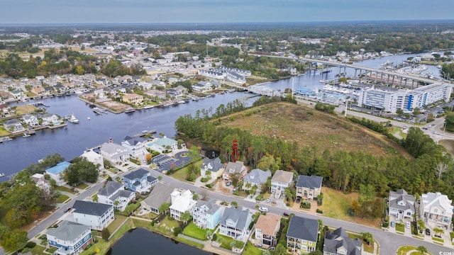 1010 Club House Dr, North Myrtle Beach, SC 29582 - aerial view of property's location featuring a large body of water and nearby suburban area