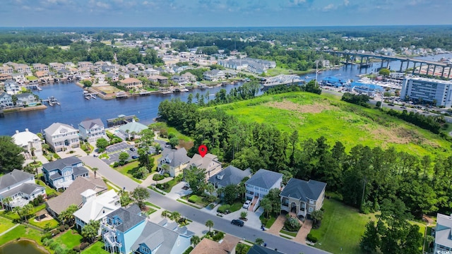 1010 Club House Dr, North Myrtle Beach, SC 29582 - aerial view of property and surrounding area featuring a nearby body of water and nearby suburban area