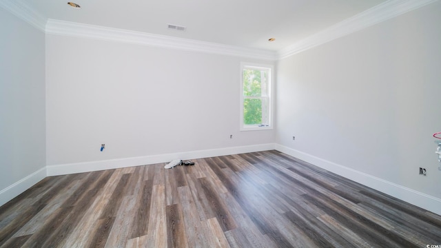 spare room with dark hardwood / wood-style flooring and ornamental molding