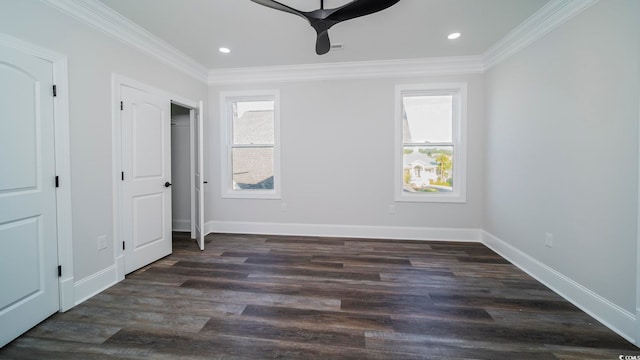 unfurnished bedroom with ceiling fan, dark hardwood / wood-style floors, and multiple windows