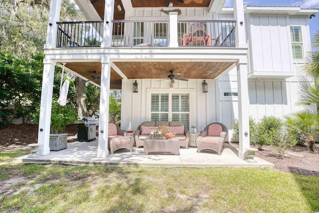 rear view of property with ceiling fan, a yard, outdoor lounge area, a patio area, and a balcony