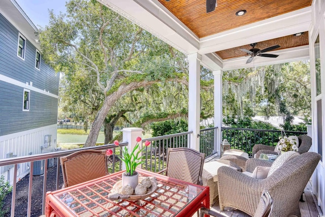 wooden terrace featuring central AC and ceiling fan