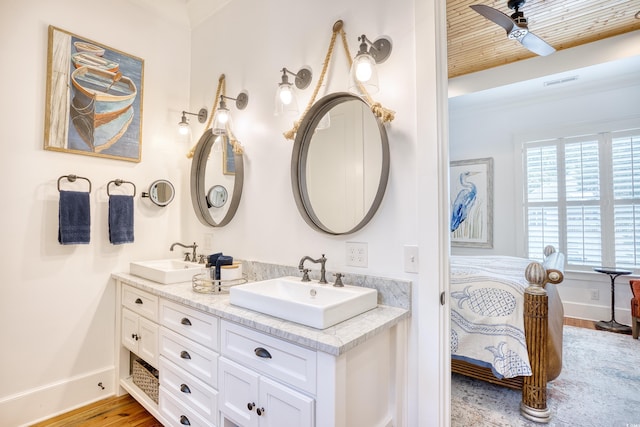 bathroom featuring hardwood / wood-style flooring, ceiling fan, vanity, and wood ceiling