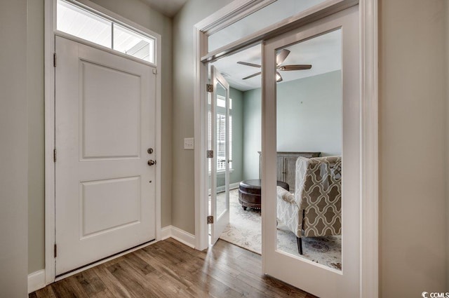 foyer entrance featuring ceiling fan and dark hardwood / wood-style flooring