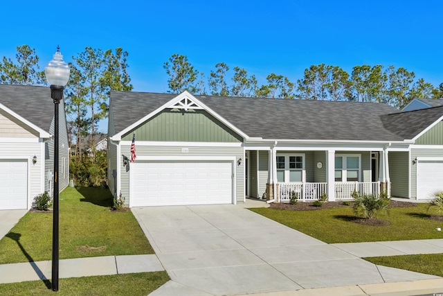 ranch-style house featuring a front lawn, a porch, and a garage