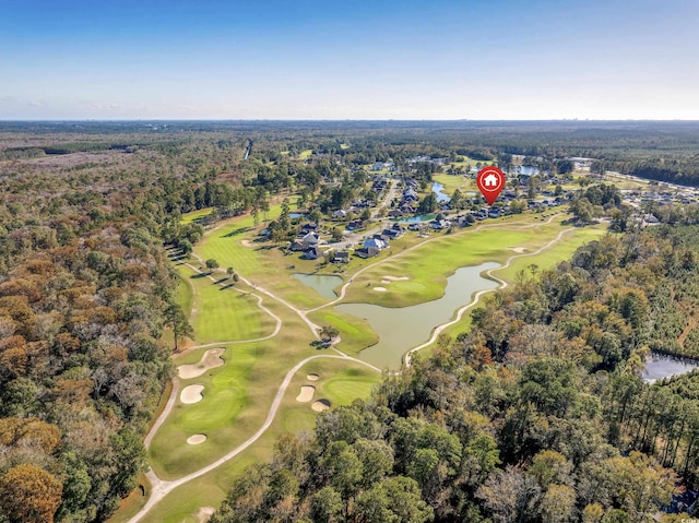 birds eye view of property with a water view, a forest view, and golf course view