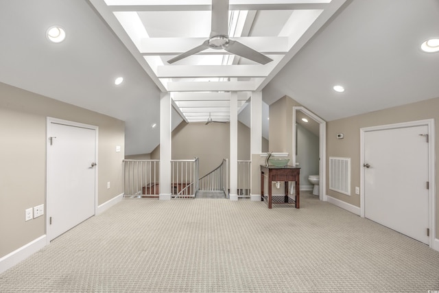 bonus room with visible vents, a ceiling fan, light carpet, vaulted ceiling, and baseboards