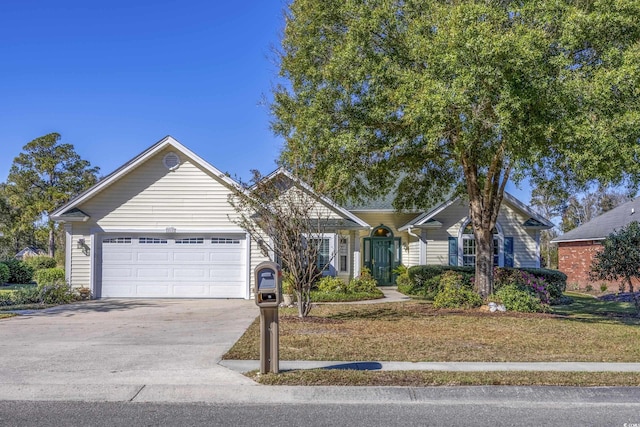 single story home with a garage and driveway