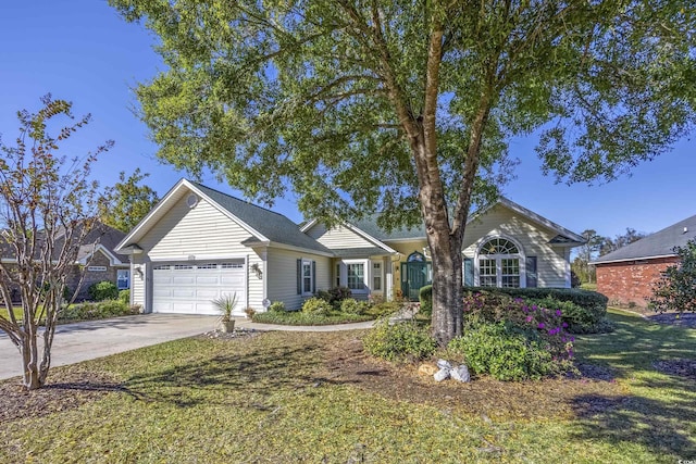 ranch-style house featuring a garage, concrete driveway, and a front yard