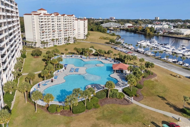 birds eye view of property with a water view