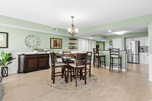 2151 Bridge View Ct Unit 2502, North Myrtle Beach, SC 29582 - dining room with light wood-style floors, baseboards, a chandelier, and recessed lighting
