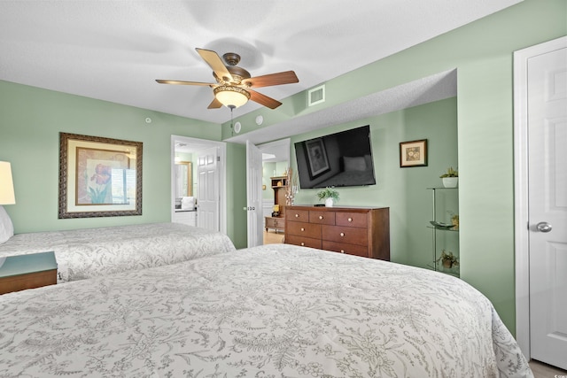 2151 Bridge View Ct Unit 2502, North Myrtle Beach, SC 29582 - bedroom with ceiling fan and ensuite bath