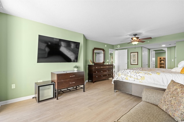 2151 Bridge View Ct Unit 2502, North Myrtle Beach, SC 29582 - bedroom featuring light wood-type flooring, baseboards, and a ceiling fan