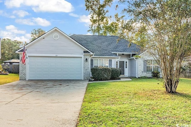 ranch-style home with a garage and a front lawn