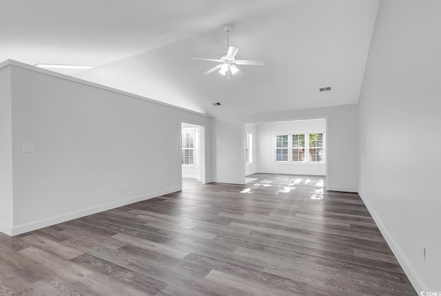 unfurnished room featuring hardwood / wood-style floors, ceiling fan, and vaulted ceiling