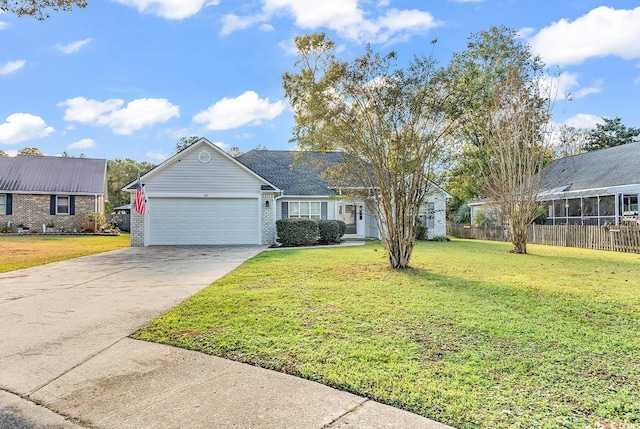 view of front of property with a front lawn and a garage