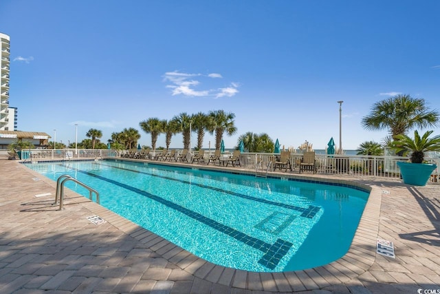 view of swimming pool featuring a patio