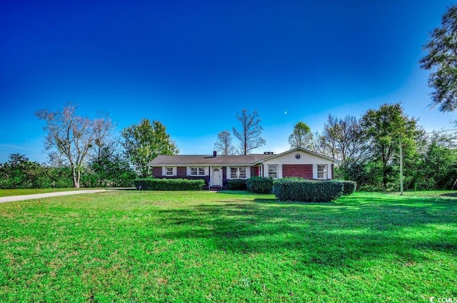 ranch-style house with a front yard