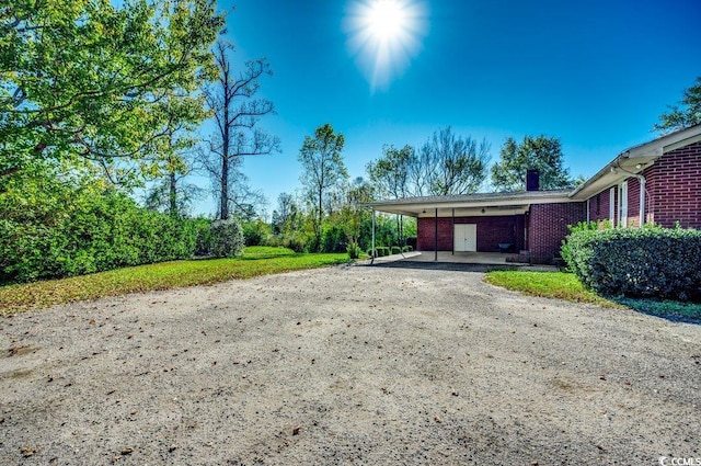 exterior space featuring a carport