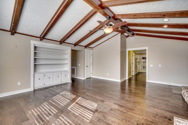 unfurnished living room with vaulted ceiling with beams, dark hardwood / wood-style floors, and a textured ceiling