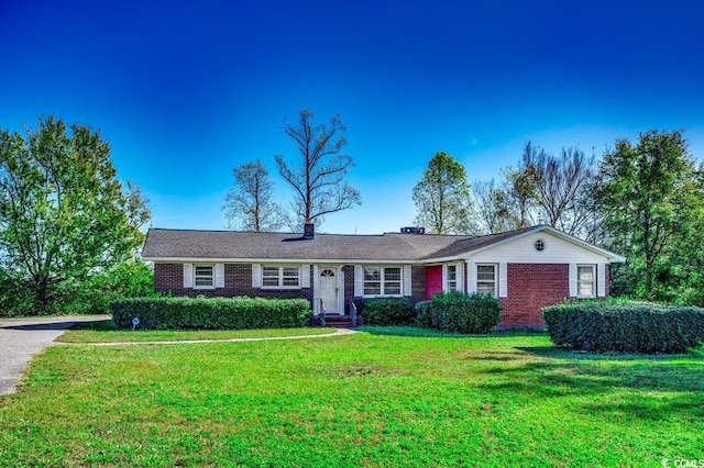 ranch-style house with a front lawn