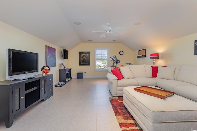 living room featuring ceiling fan, light tile patterned flooring, and vaulted ceiling