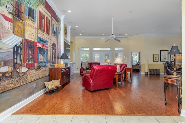 living room featuring ceiling fan, wood-type flooring, and ornamental molding