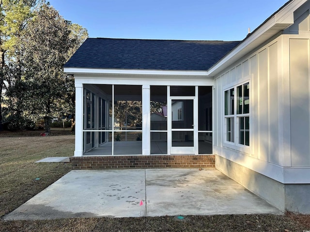 view of patio / terrace featuring a sunroom