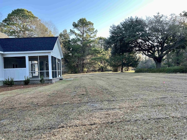 view of yard with a sunroom