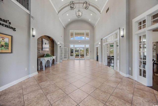 656 Pistoia Ln Unit 304, Myrtle Beach, SC 29579 - foyer entrance with an inviting chandelier, arched walkways, high vaulted ceiling, french doors, and recessed lighting