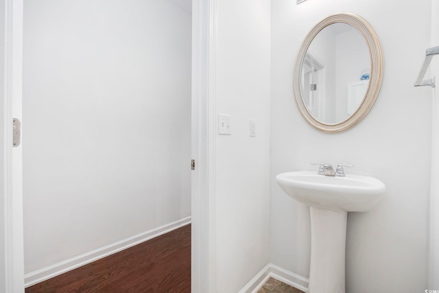 656 Pistoia Ln Unit 304, Myrtle Beach, SC 29579 - bathroom featuring a sink, baseboards, and wood finished floors